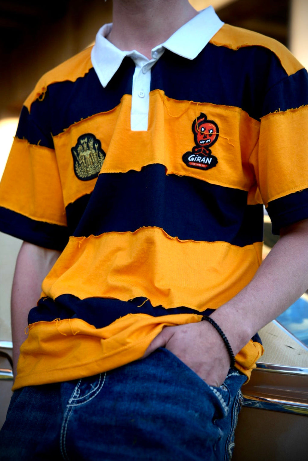 GÍRÁN Shortsleeved “Golden Rebellion” Distressed Rugby Polo